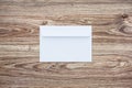 Blank white envelope on wooden background