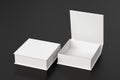 Blank white flat square gift box with open and closed hinged flap lid on black background. Clipping path around box mock up.