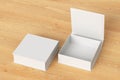 Blank white flat square gift box with open and closed hinged flap lid on wooden background.