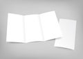 Blank white folding paper flyer on gray background Royalty Free Stock Photo