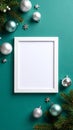 Blank White Frame Surrounded by Christmas Ornaments and Pine Branches on Teal Background Royalty Free Stock Photo