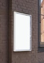 Blank white glass rectangular poster mockup brick wall mounted Royalty Free Stock Photo