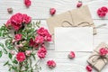 Blank white greeting card and gift box with pink rose flowers bouquet Royalty Free Stock Photo