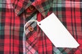 A blank white label or tag attached on shirt Royalty Free Stock Photo