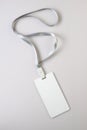 Blank White Lanyard Tag Badge Mockup on grey background Royalty Free Stock Photo