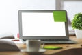 Blank white laptop with green sticker Royalty Free Stock Photo