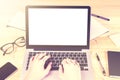 Blank white laptop screen with girl hands and office accessories Royalty Free Stock Photo