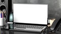 Blank white laptop screen set on office desk Royalty Free Stock Photo