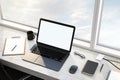 Blank white mock up laptop screen on on windowsill with notebook, glasses and coffee mug