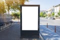 Blank white mock up of vertical light box billboard at city street