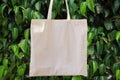 Mockup Linen Cotton Tote Bag on Green Forest Trees Foliage Background. Eco Nature Friendly. Environmental Conservation Recycling