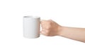 Blank white mug, held by an isolated hand, offers endless possibilities for Print-on-Demand Royalty Free Stock Photo