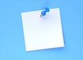 Blank white note paper with blue push pin isolated on blue pastel color wall background Royalty Free Stock Photo