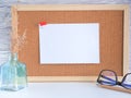 The blank white note pinned on a corkboard . Royalty Free Stock Photo