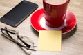 Blank white notebook open, eyeglass, pen and cup of coffee on the desk Royalty Free Stock Photo