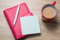 Blank white notebook open, eyeglass, pen and cup of coffee on the desk Royalty Free Stock Photo