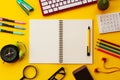 Blank white notepad with office and personal accessories isolated on yellow background Royalty Free Stock Photo