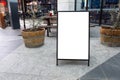 Blank white outdoor advertising stand/sandwich board mock up template. Clear street signage board placed outdoor.