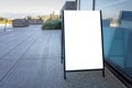 Blank white outdoor advertising stand/sandwich board mockup template. Clear street signage board placed on a pedestrian sidewalk. Royalty Free Stock Photo