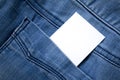 Blank white paper or card in back pocket of blue jeans with copyspace for sale text or business concept Royalty Free Stock Photo