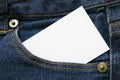 Blank white paper or card in front pocket of blue jeans with copyspace for sale text or business concept Royalty Free Stock Photo