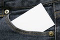 Blank white paper or card in front pocket of dark blue jeans with copyspace for sale text or business concept Royalty Free Stock Photo