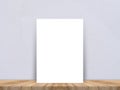 Blank white paper poster at tropical plank wooden floor and paper wall, Template mock up for adding your content,leave side space Royalty Free Stock Photo