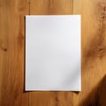 Blank White Paper Resting on a Wooden Surface, Ideal for Creative Projects and Writing Ideas Without Distractions Royalty Free Stock Photo