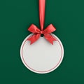 Blank white paper round christmas ball frame tag label card template hanging with shiny red ribbon and bow Royalty Free Stock Photo