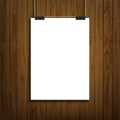 Blank white paper sheet template hanging on wal