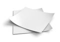 Blank white paper sheets stacked on a clean white surface ready for creative use Royalty Free Stock Photo