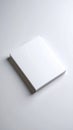 Blank white paper stack on a white surface with soft shadows and subtle lighting Royalty Free Stock Photo