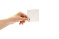 Blank, white paper for text in a female hand. Close-up. Place for text. Royalty Free Stock Photo