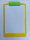 A Blank White Paper on a Yellow Clipboard