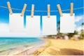 Blank white papers hanging on rope on beach