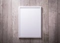 Blank white picture frame on the wood wall Royalty Free Stock Photo