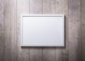 Blank white picture frame on the wood wall Royalty Free Stock Photo