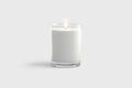 Blank white pillar candle in glass jar mockup, gray background Royalty Free Stock Photo