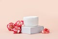 Blank white plastic container for cream, lotion, nourishing or moisturizing mask on stand. Feminine hygienic product