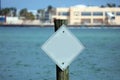 Blank white pole sign over water in marina background south Florida Miami Beach