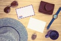 Blank white postcard and air mail envelope on wooden table. Travel card top view. Vintage summer travel flat lay Royalty Free Stock Photo