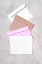 Blank white postcard and three various envelopes