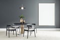 Blank white poster on black wall in modern dining room with round table and black wooden chairs on ceramic tiles floor. Mock up Royalty Free Stock Photo