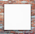 Blank white poster on brick wall background Royalty Free Stock Photo