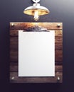 Blank white poster clipped on rustic wood with pendant industrial lamp