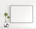 Blank white poster frame, black frame in the livingroom, elegant simple white wall, modern display cabinet, table top, white book, Royalty Free Stock Photo