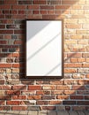 Blank White Poster Frame on a Distressed Brick Wall with Sunlight and Wooden Floor Royalty Free Stock Photo