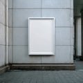 Blank White Poster Frame on Textured Gray Building Wall Royalty Free Stock Photo