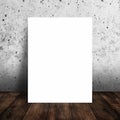 Blank white poster in interior with wood floor and concrete wall texture background. Royalty Free Stock Photo
