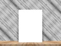 Blank white poster leaning at tropical wood table top with plank Royalty Free Stock Photo